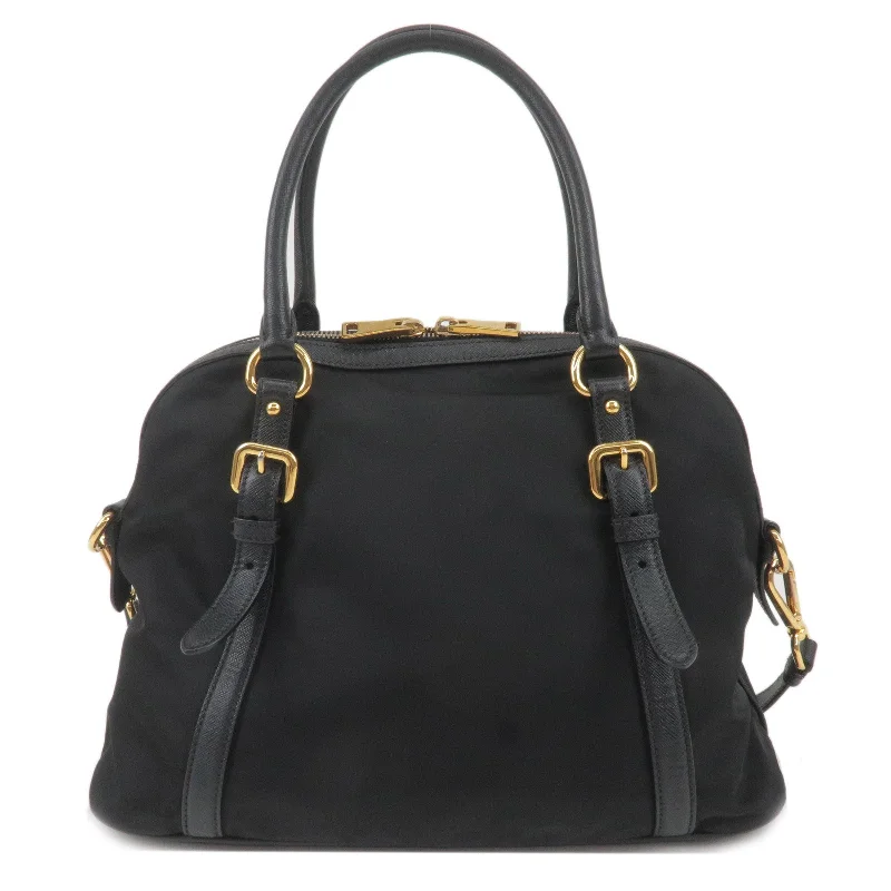 Prada Cleo bags with a contrast - colored interior for visual interestPrada Cleo bags with a contrast - colored interior for visual interestPRADA Logo Nylon Leather 2Way Bag Hand Bag Shoulder Bag Black