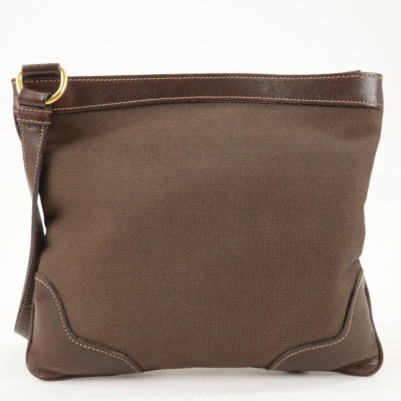 Prada Galleria bags with a structured silhouette for a professional lookPrada Galleria bags with a structured silhouette for a professional lookPRADA Logo Jacquard Canvas Leather Shoulder Bag Brown