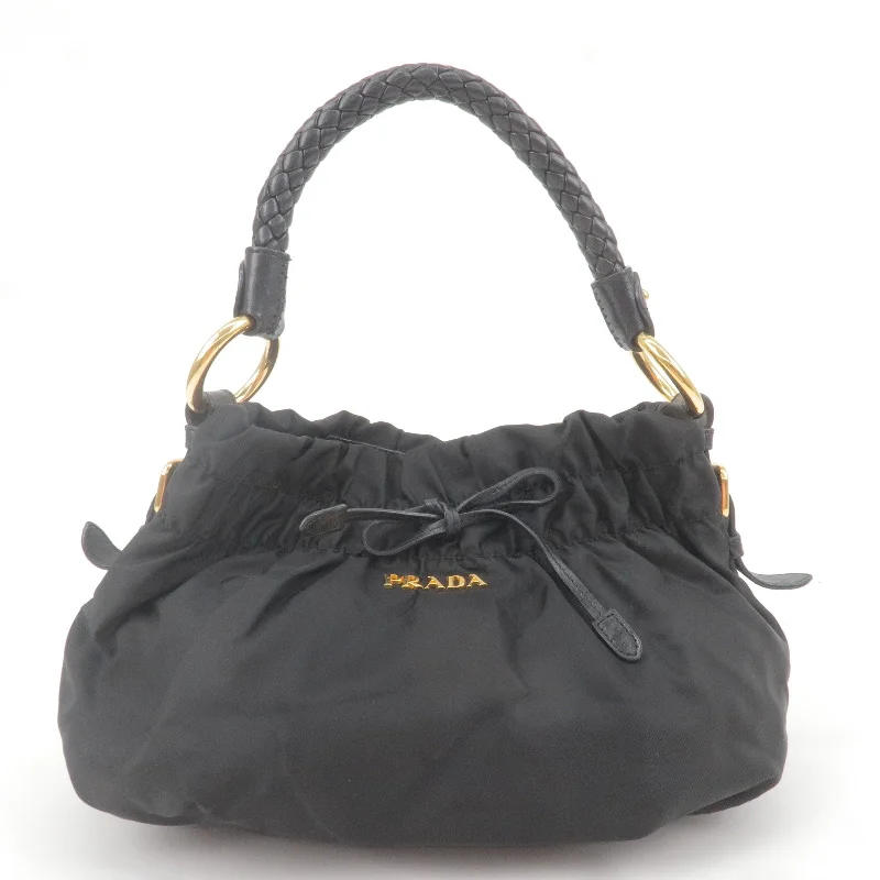 Prada bags with a zippered interior pocket for separating itemsPrada bags with a zippered interior pocket for separating itemsPRADA Logo Nylon Leather Shoulder Bag Hand Bag Black BR4237