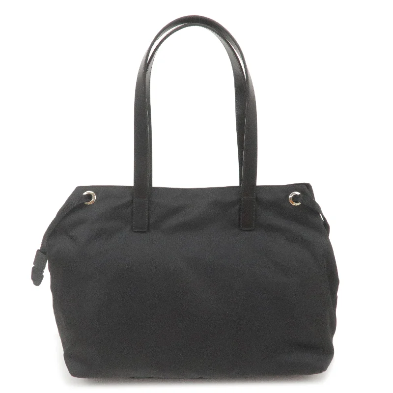 Prada Cleo bags with a detachable coin purse for added functionalityPrada Cleo bags with a detachable coin purse for added functionalityPRADA Logo Nylon Leather Tote Bag Hand Bag NERO Black BR3257