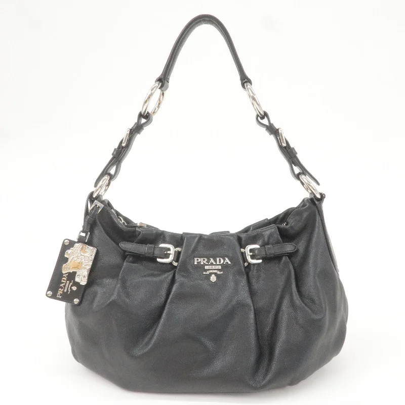 Prada Cleo bags with a contrast - colored interior for visual interestPrada Cleo bags with a contrast - colored interior for visual interestPRADA Logo Leather Shoulder Bag Hand Bag Black BR3795