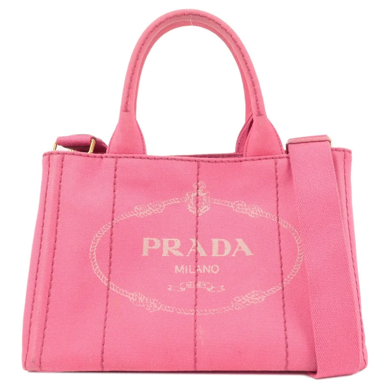 Prada bags with a zippered interior pocket for separating itemsPrada bags with a zippered interior pocket for separating itemsPRADA Logo Canapa Mini Canvas 2Way Tote Bag Pink 1BG439