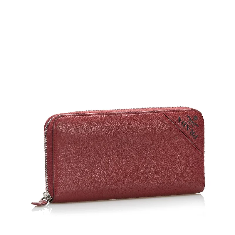 Prada Cahier bags with a monogram - embossed leather surfacePrada Cahier bags with a monogram - embossed leather surfacePrada Saffiano Continental Wallet 36971