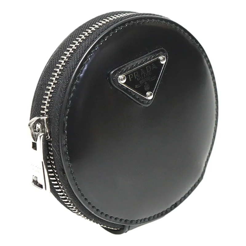 Prada Cahier bags featuring the signature triangular logo plaquePrada Cahier bags featuring the signature triangular logo plaquePrada Triangle Plaque Smooth Black Leather Round Mini Pouch Keychain