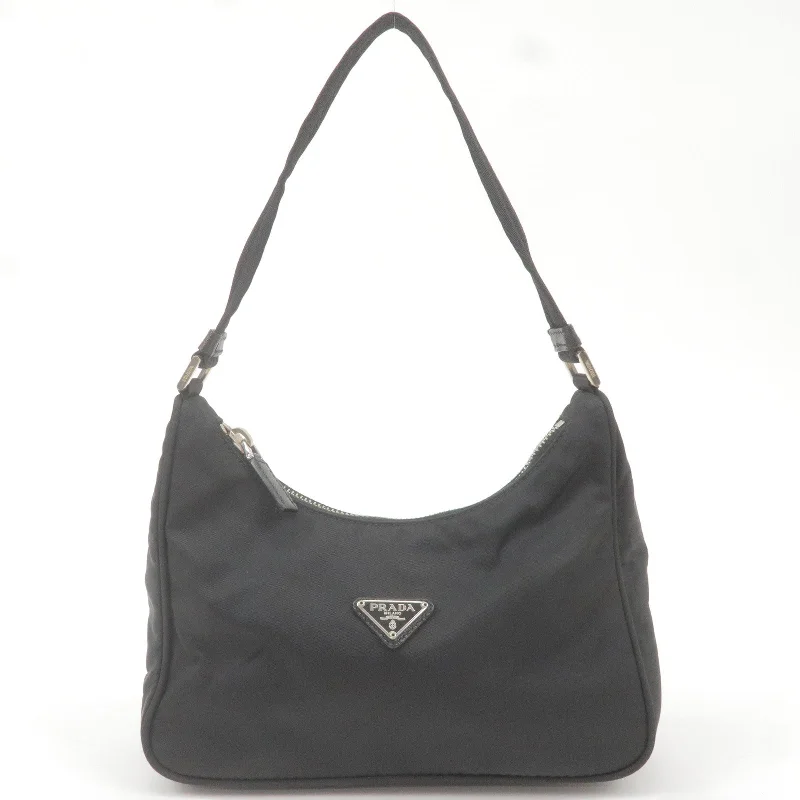 Ladies Prada handbags with a detachable wallet inside for added convenienceLadies Prada handbags with a detachable wallet inside for added conveniencePRADA Logo Nylon Leather Shoulder Bag NERO Black 1N1204