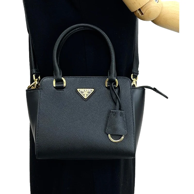 Ladies Prada handbags with a detachable wallet inside for added convenienceLadies Prada handbags with a detachable wallet inside for added conveniencePrada Triangle Logo Black Saffiano Lux Leather Crossbody Tote Bag