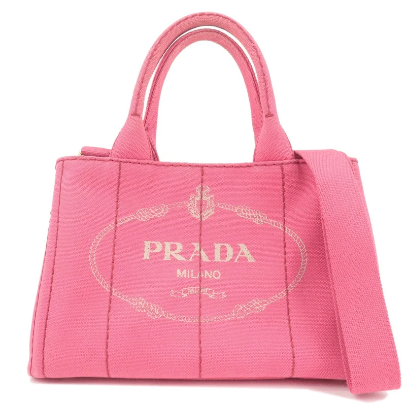 Prada bags with a zip - top closure and multiple interior pockets for organizationPrada bags with a zip - top closure and multiple interior pockets for organizationPRADA Logo Canapa Mini Canvas 2Way Tote Bag Pink 1BG439