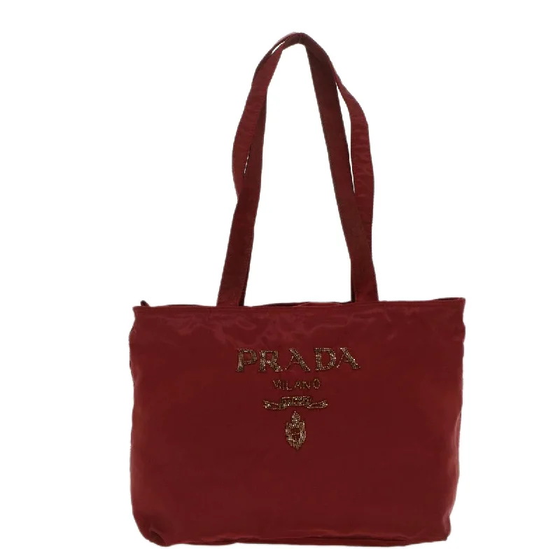 Prada Cahier bags featuring the signature triangular logo plaquePrada Cahier bags featuring the signature triangular logo plaquePRADA Tessuto Tote