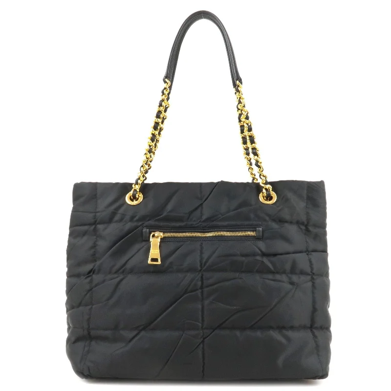 Prada tote bags with a printed Prada logo on the front for brand visibilityPrada tote bags with a printed Prada logo on the front for brand visibilityPRADA Logo Nylon Leather Chain Tote Bag Black BR4383