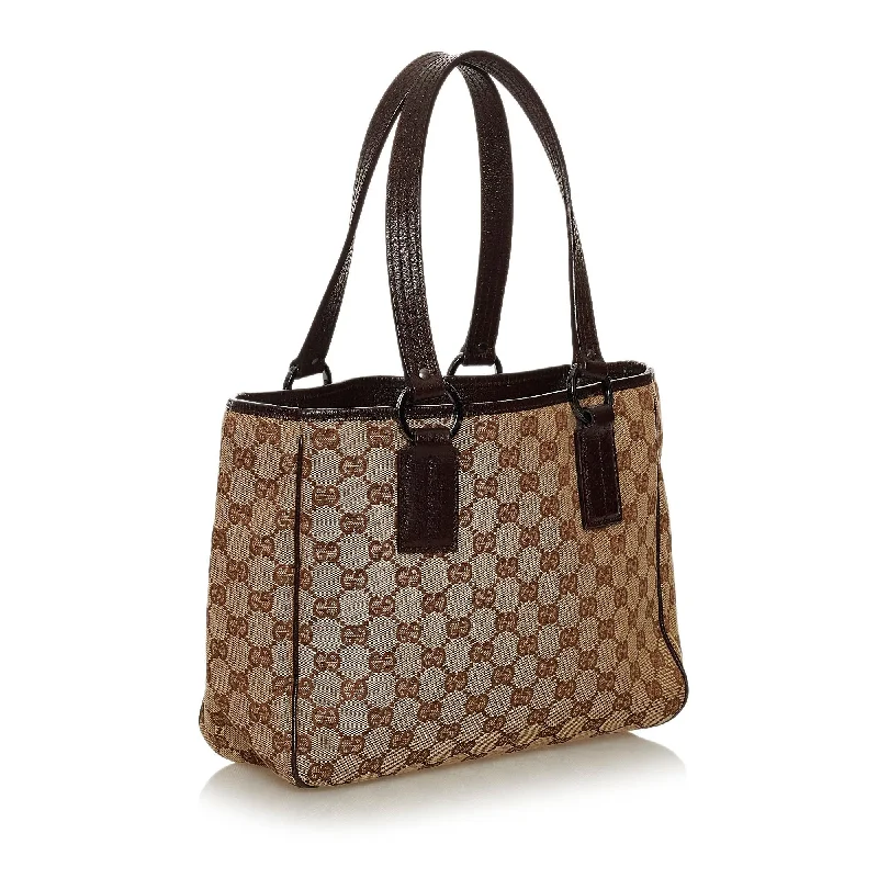 Women Gucci bags with a chain - link trim and a leather bodyGucci GG Canvas Tote Bag (28886)