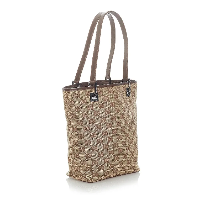 Women Gucci bags with a snap - button closure and a decorative charmGucci GG Canvas Tote Bag (32205)