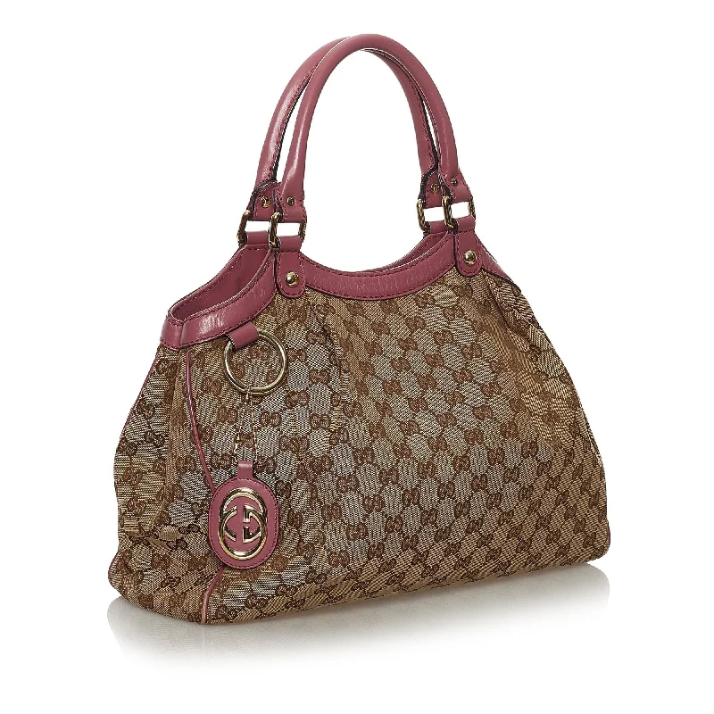 Women Gucci bags with a snap - button closure and a decorative charmGucci GG Canvas Sukey Tote Bag (33051)