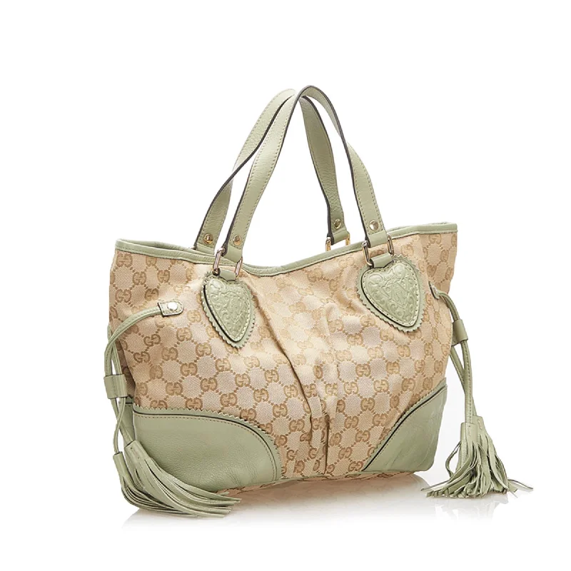 Women Gucci bags with a front - zip pocket for small itemsGucci GG Canvas Tote Bag (32178)