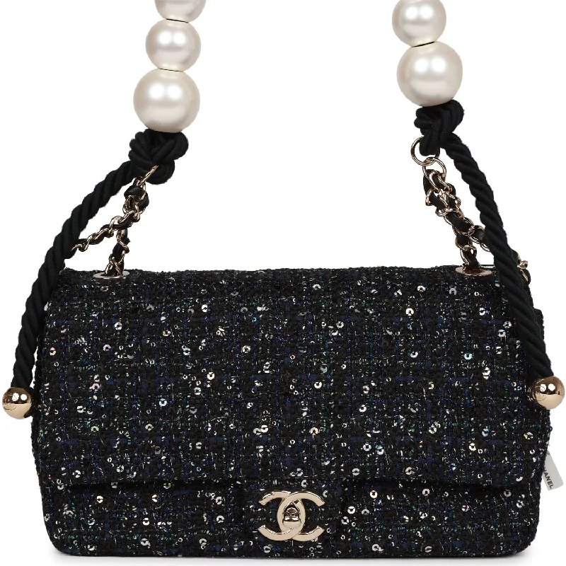 Chanel bags with exclusive seasonal releasesChanel bags with exclusive seasonal releasesChanel Medium Pearl Handle Flap Bag Dark Blue Tweed Boucle Light Gold Hardware