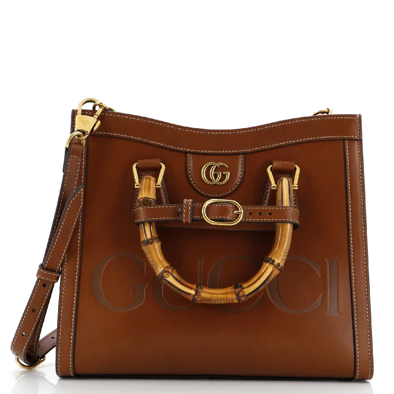 Women Gucci bags with a snap - button closure and a decorative charmDiana NM Logo Bamboo Handle Tote Embossed Leather Small